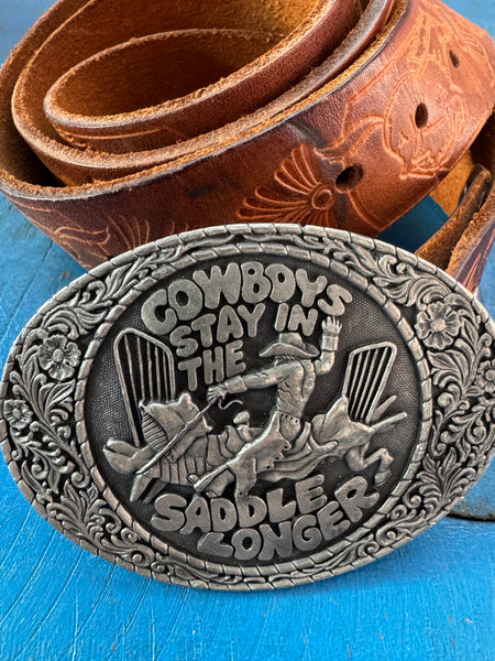 1981 VINTAGE BROWN LEATHER BELT WITH SILVER COWBOY BUCKLE