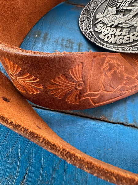 1981 VINTAGE BROWN LEATHER BELT WITH SILVER COWBOY BUCKLE