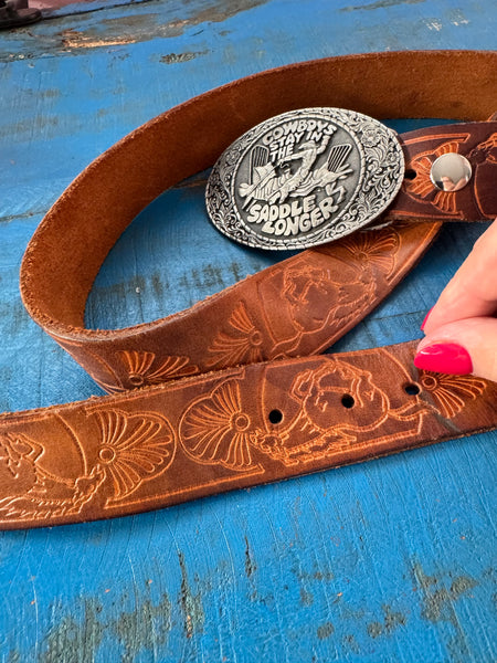 1981 VINTAGE BROWN LEATHER BELT WITH SILVER COWBOY BUCKLE