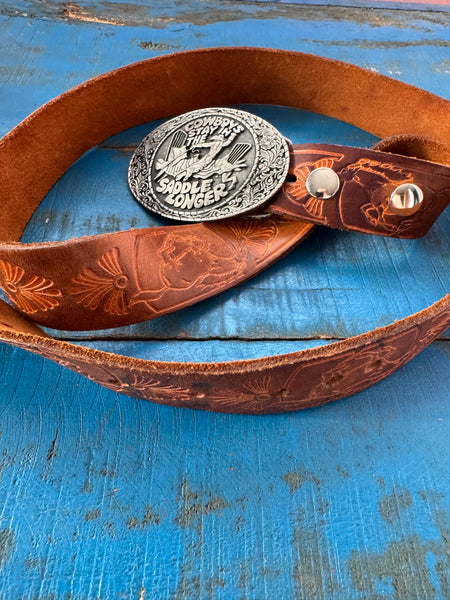 1981 VINTAGE BROWN LEATHER BELT WITH SILVER COWBOY BUCKLE
