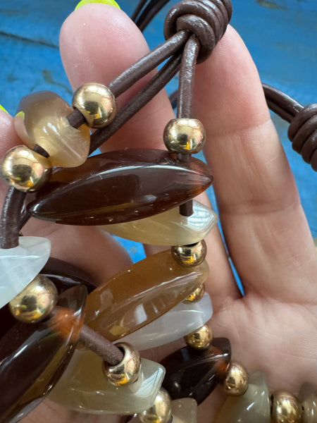 VINTAGE TRIPLE STRAND BROWNS AND WHITE LUCITE PENDANTS NECKLACE
