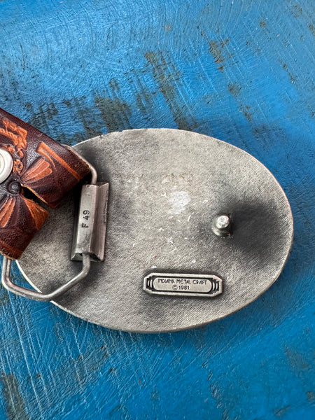 1981 VINTAGE BROWN LEATHER BELT WITH SILVER COWBOY BUCKLE