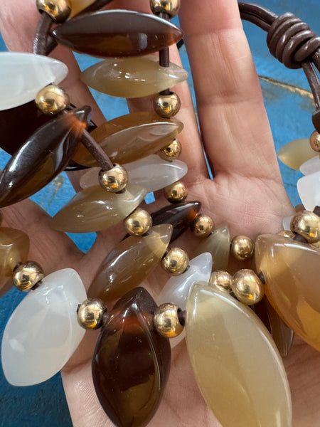 VINTAGE TRIPLE STRAND BROWNS AND WHITE LUCITE PENDANTS NECKLACE