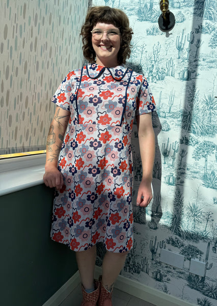 SIXTIES SCOOTER GIRL NAVY BLUE AND ORANGE FLOWERS PRINT DRESS