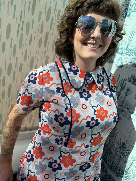 SIXTIES SCOOTER GIRL NAVY BLUE AND ORANGE FLOWERS PRINT DRESS