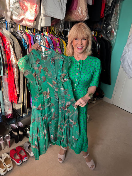 Toyah holding her All Saints green dress
